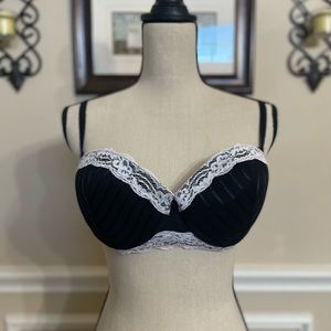 Q-T Intimates Bra. Black with white lace, underwire, lightly padded.